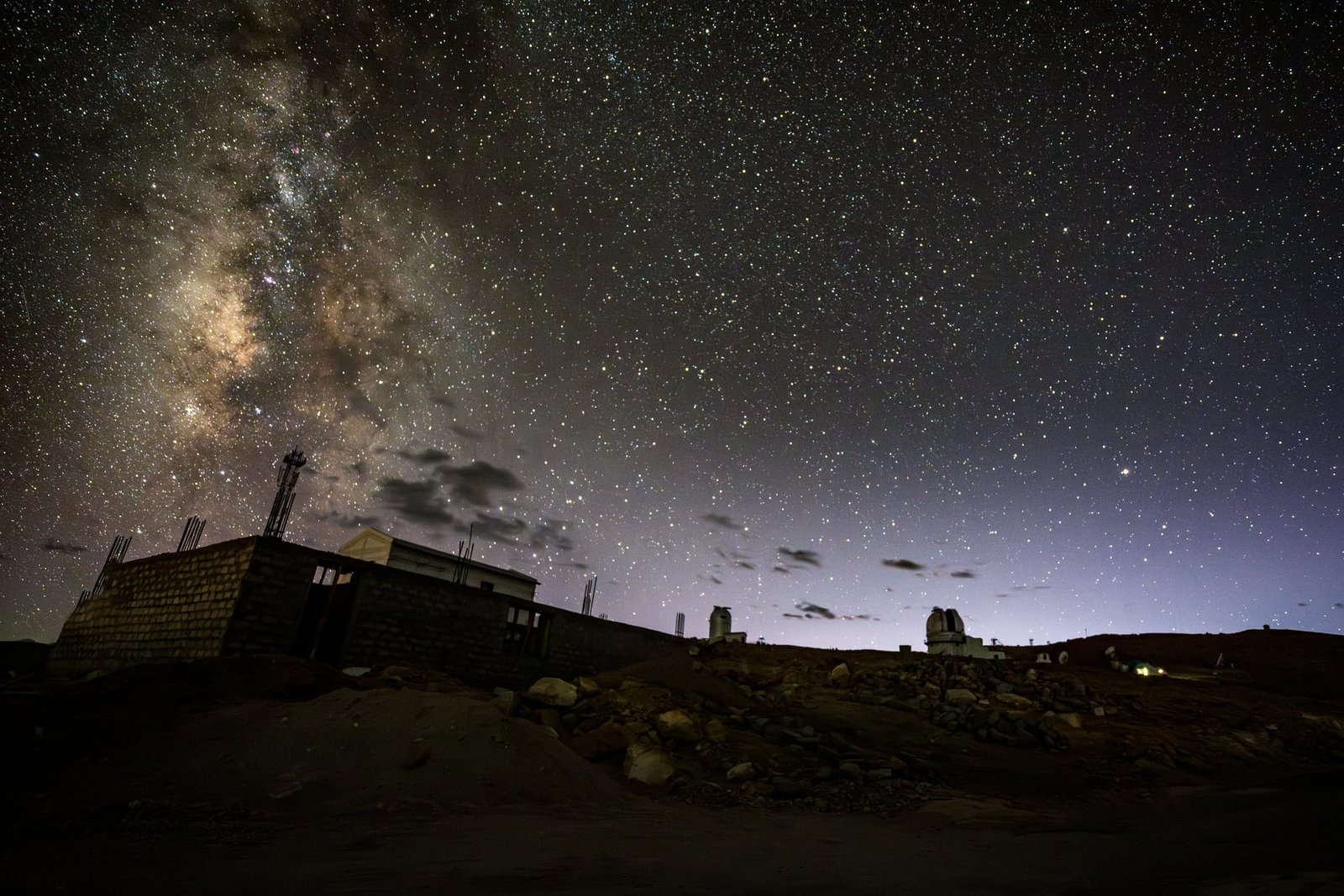 Starry night sky over Hanle with observatory buildings