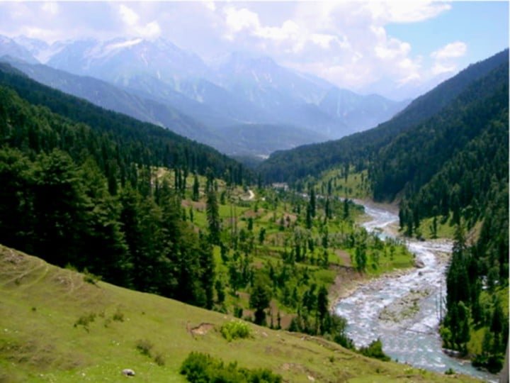 Green valley with river and mountains in Baisaran