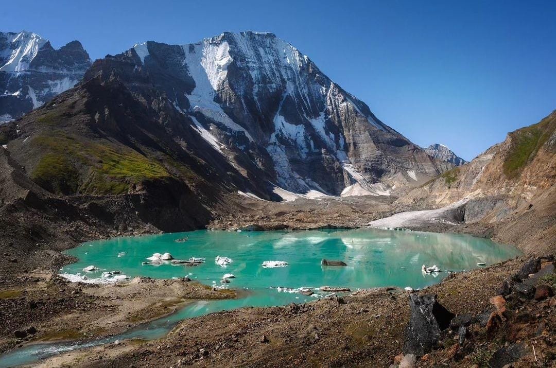 an alpine lake on the warwan valley trek