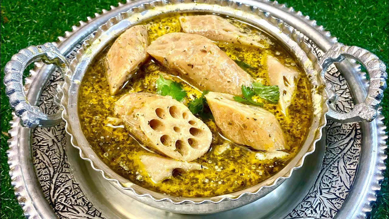 Traditional Kashmiri Nadru Yakhni served in a silver bowl