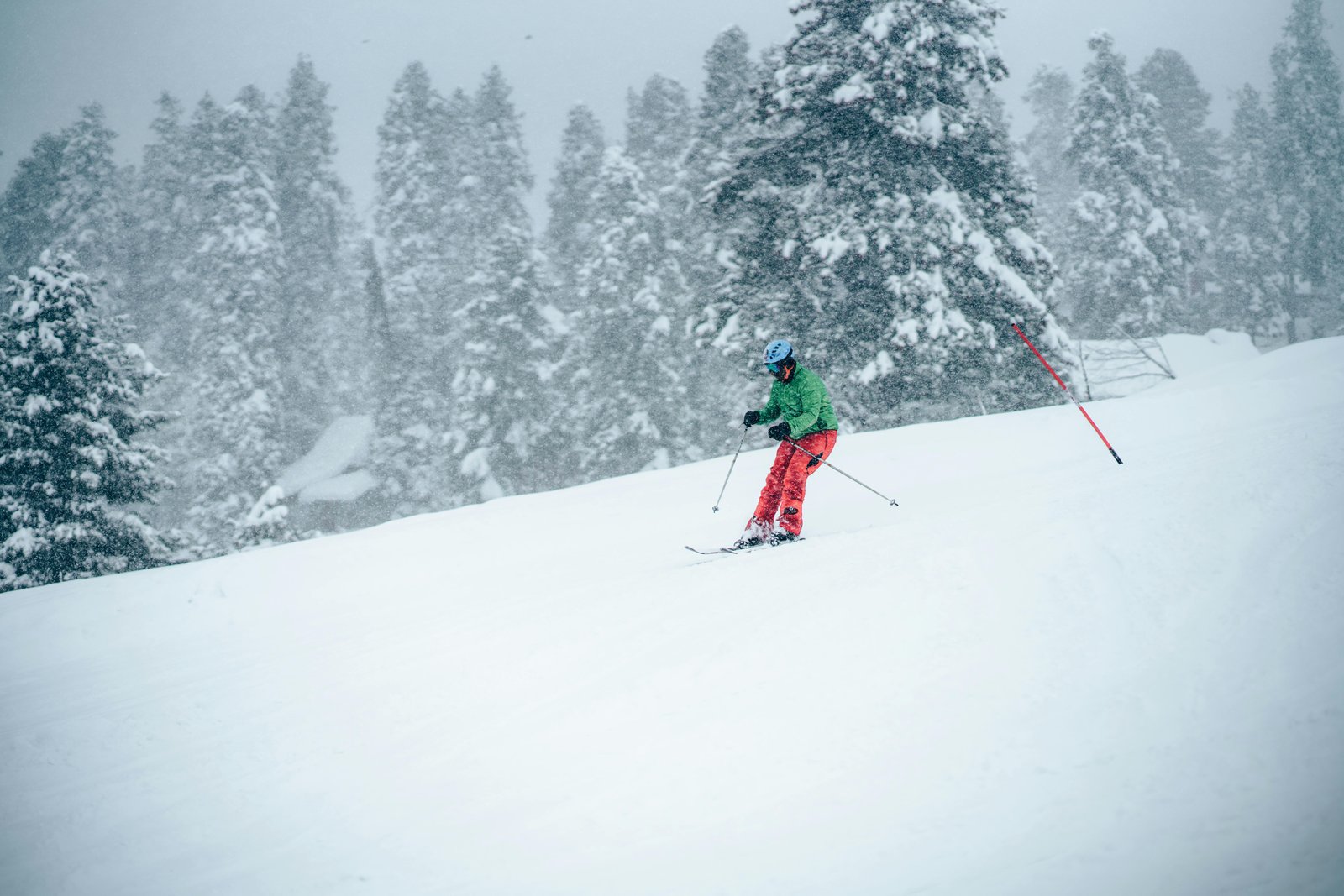 a man skiing down the slopes of gulmarg