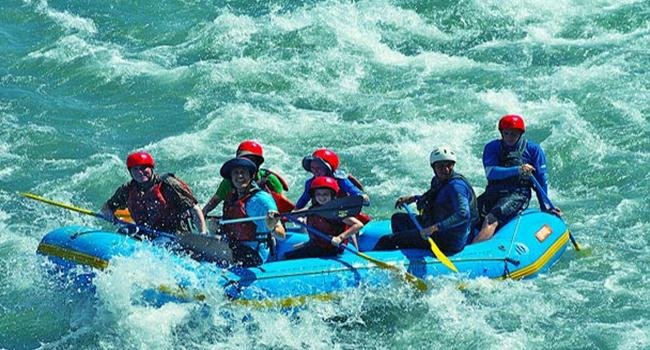 tourists are enjoying river rafting in kashmir