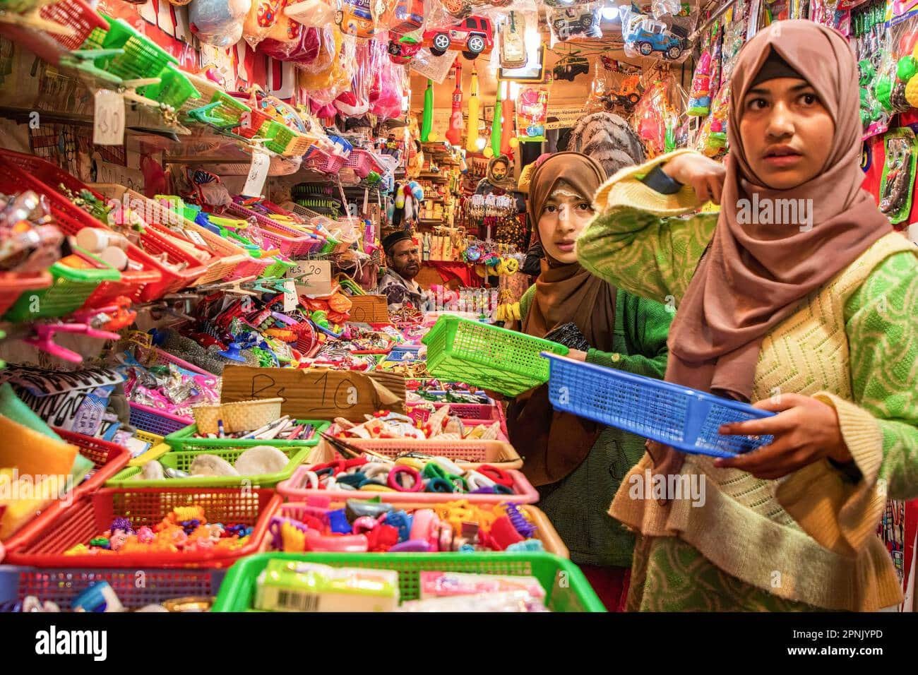 Women shopping in a colorful toy store in kashmir