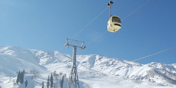 Cable car gliding over snow-covered slopes in a winter