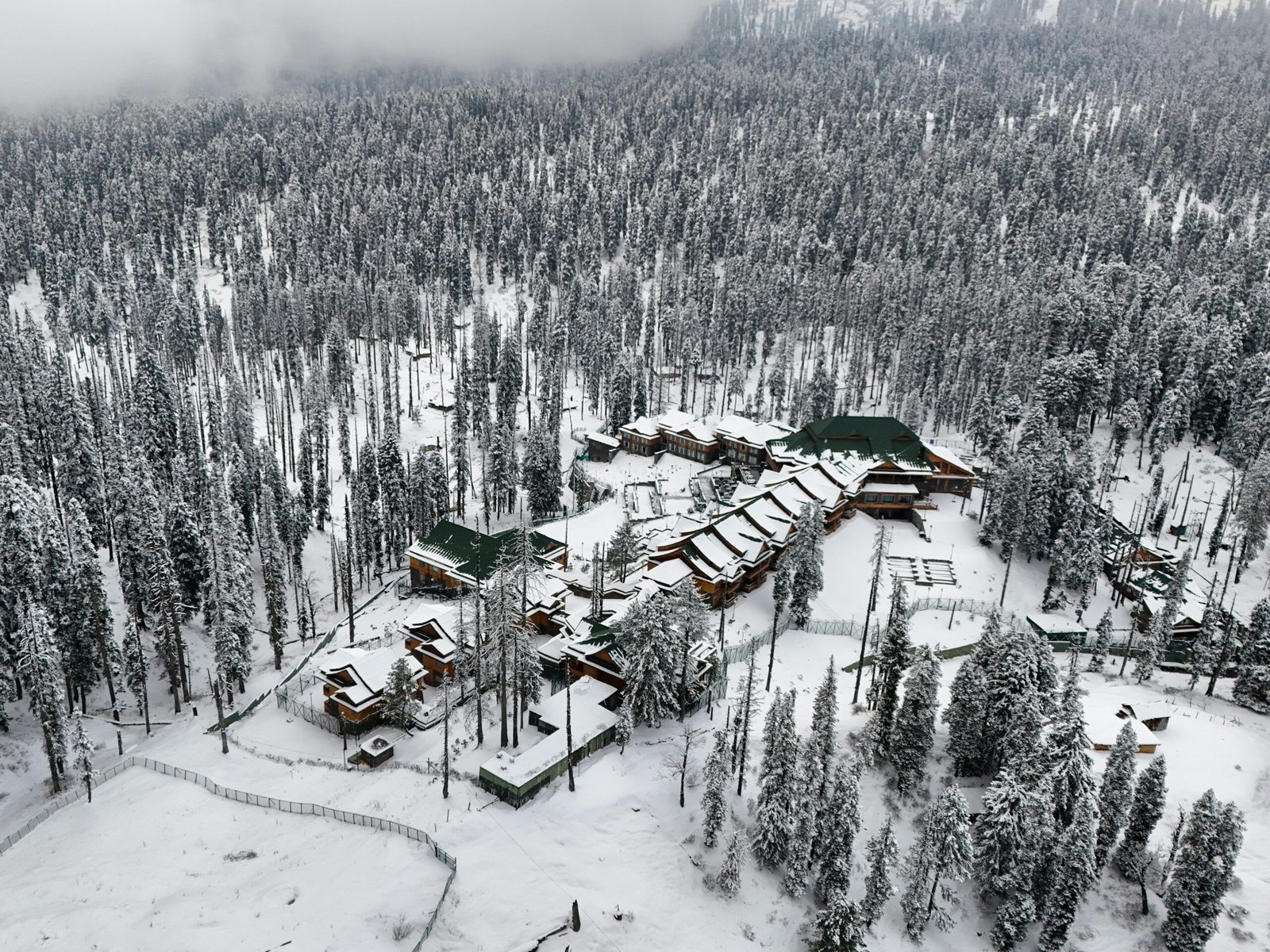 panoramic view of snow covered houses in kashmir during the month december