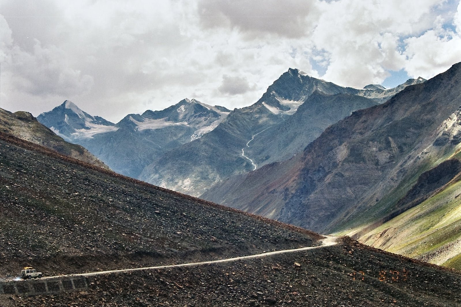 Mountain road winding through rugged terrain at Marsimik La Pass