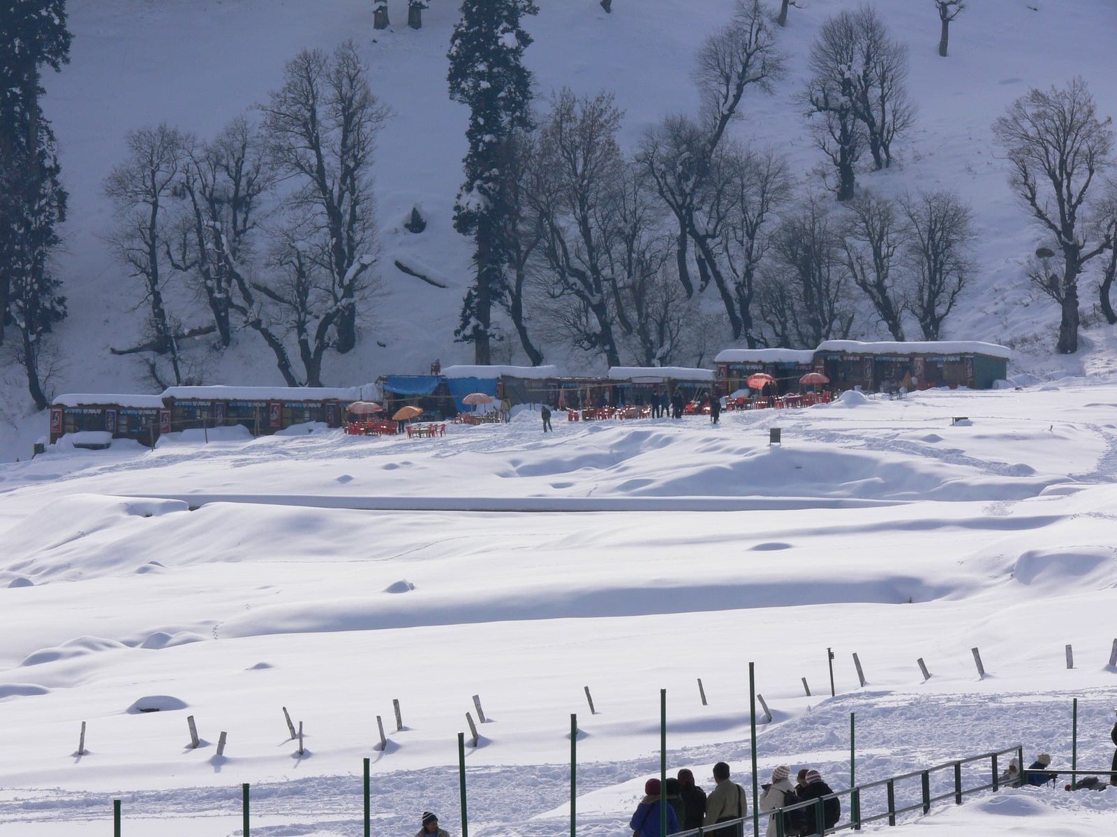 Snowy huts and tourists in Khilanmarg, Kashmir