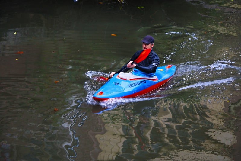tourists enjoying kayaking at nigeen lake