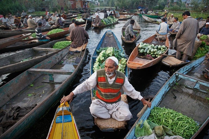 Shikara's selling vegetable in floating water in Srinagar