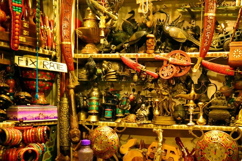 Colorful Kashmiri handicrafts and souvenirs displayed in a local market shop