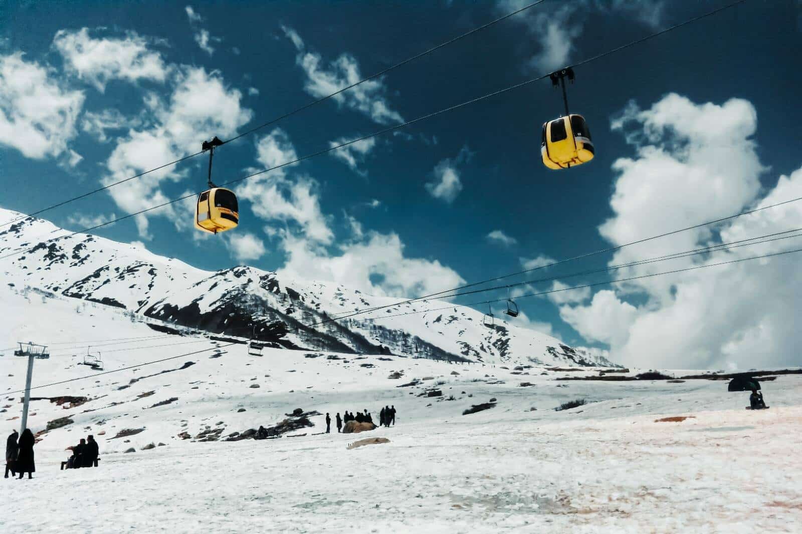 gulmarg gondola moving over a snowy mountain landscape in gulmarg, kashmir