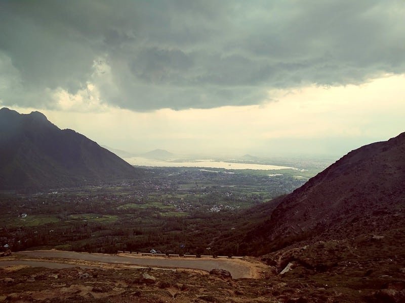 Cloudy view of a Astanmarg valley and lake from a mountain road