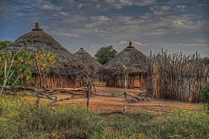 Traditional huts surrounded by wooden fences in a rural village of botapathri gulmarg