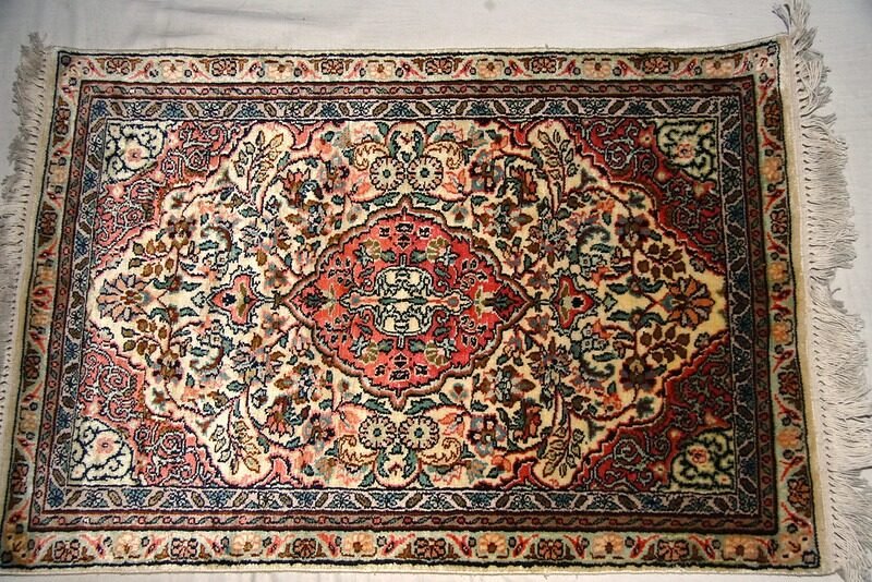 traditinal kashmiri carpet with floral embroidery