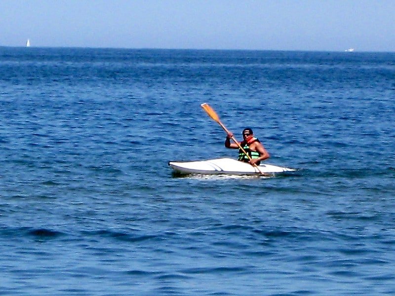 tourist enjoying kayaking in nigenn lake calm water