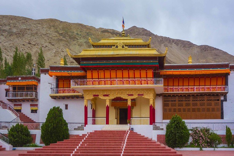 Front view of Samstanling Monastery with red and golden architecture