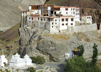 Bardan Monastery on a rocky cliff with stupas in front in Padum