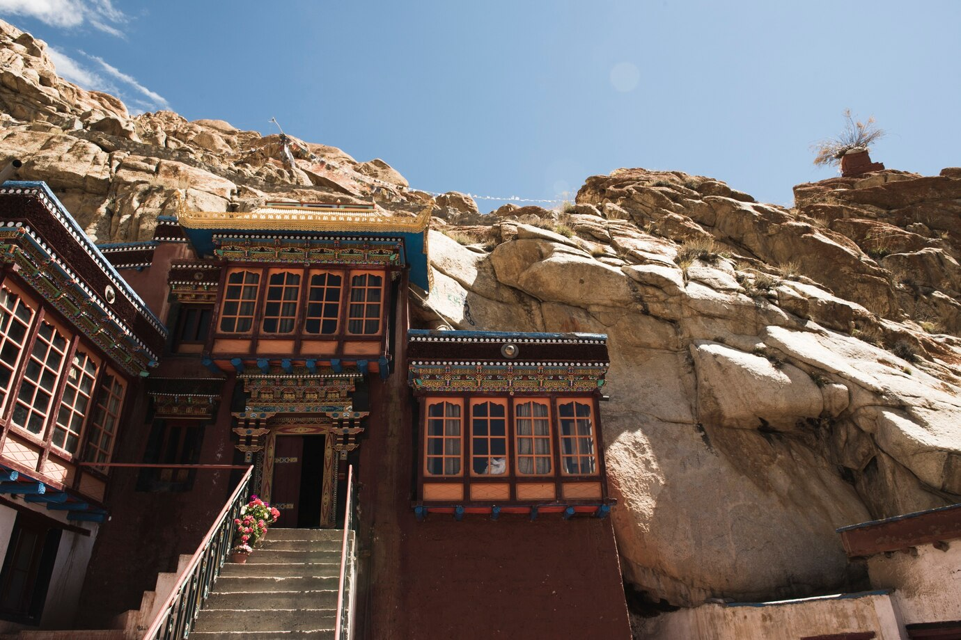 Traditional building of the Museum of Memories built into rocky cliff in Hunderman Village