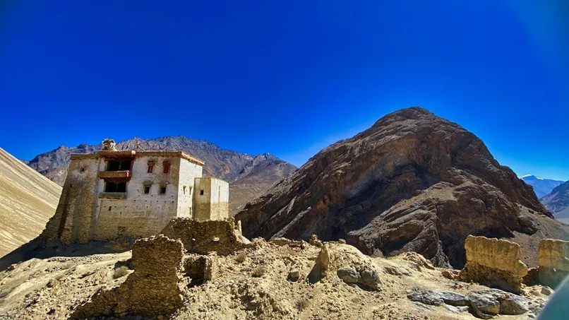 Zangla Palace on a barren hill with rocky mountains in padum