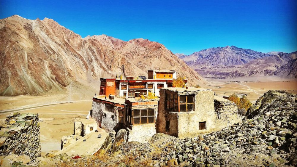 Stongdey Monastery on a rocky hill with mountains in the padum valley