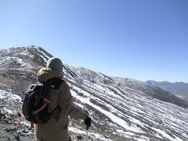 Trekker enjoying the snow-covered mountain views in Ladakh