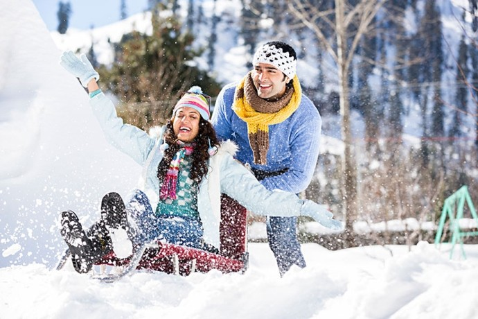 Honeymoon couple enjoying snow in Gulmarg