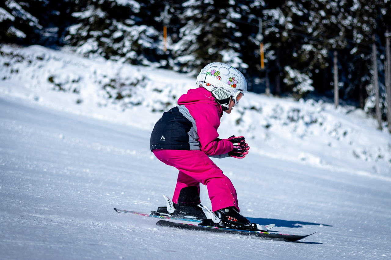 Child skiing on a snow-covered slope in Kashmir during winter
